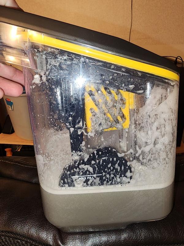 Customer photo: dirty water tank showing trapped hair and debris